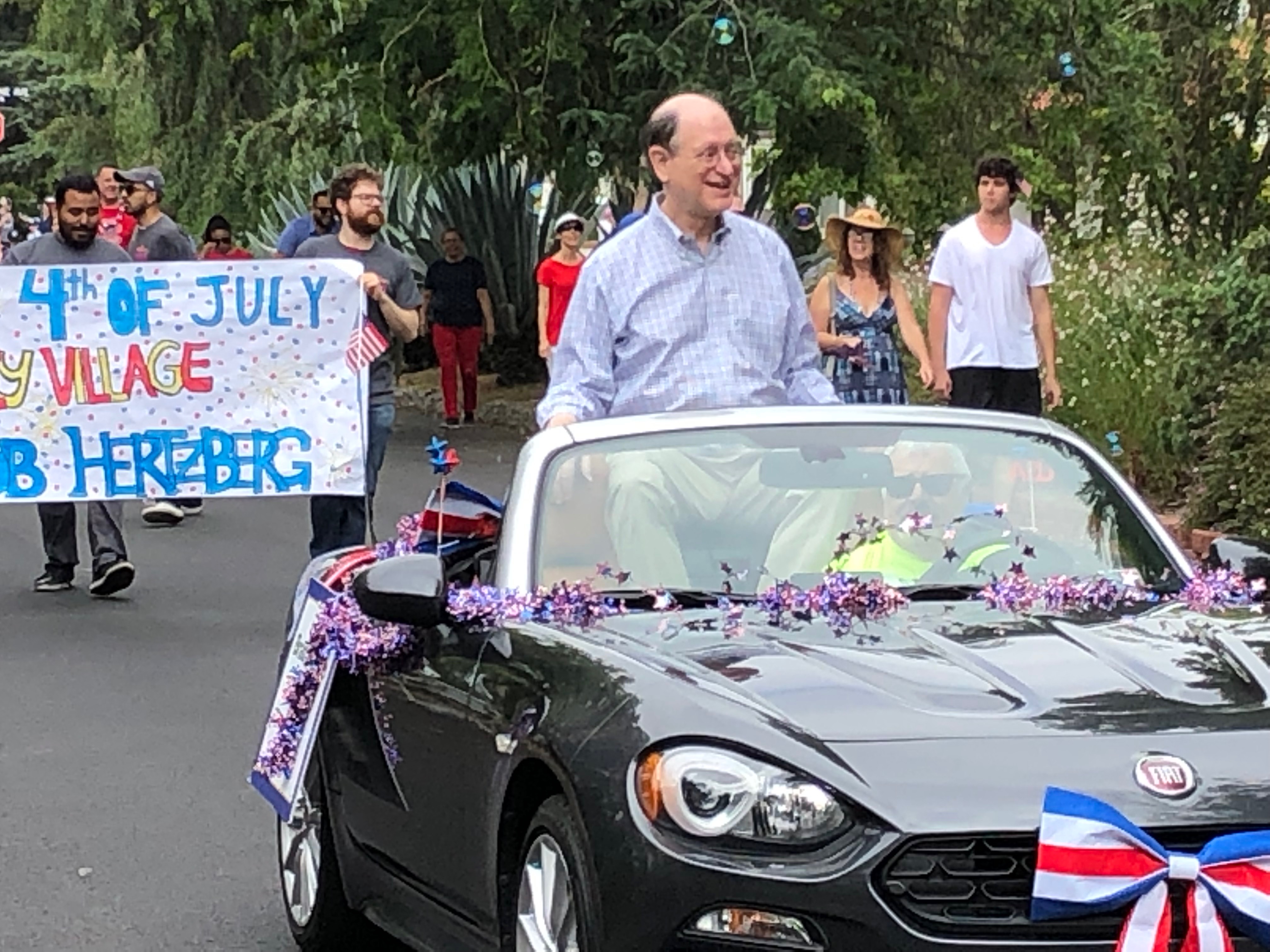 Rep. Sherman riding in car at 4th of July parade