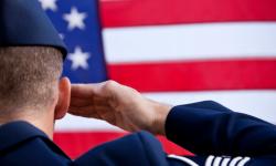 soldier saluting the US flag