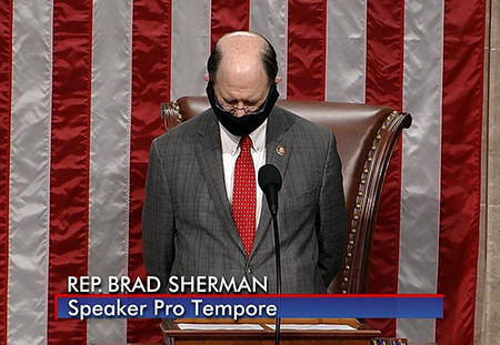 Sherman Presides over the House wearing a Mask