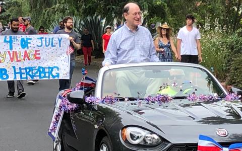 Rep. Sherman Riding in a car during a 4th of July Parade