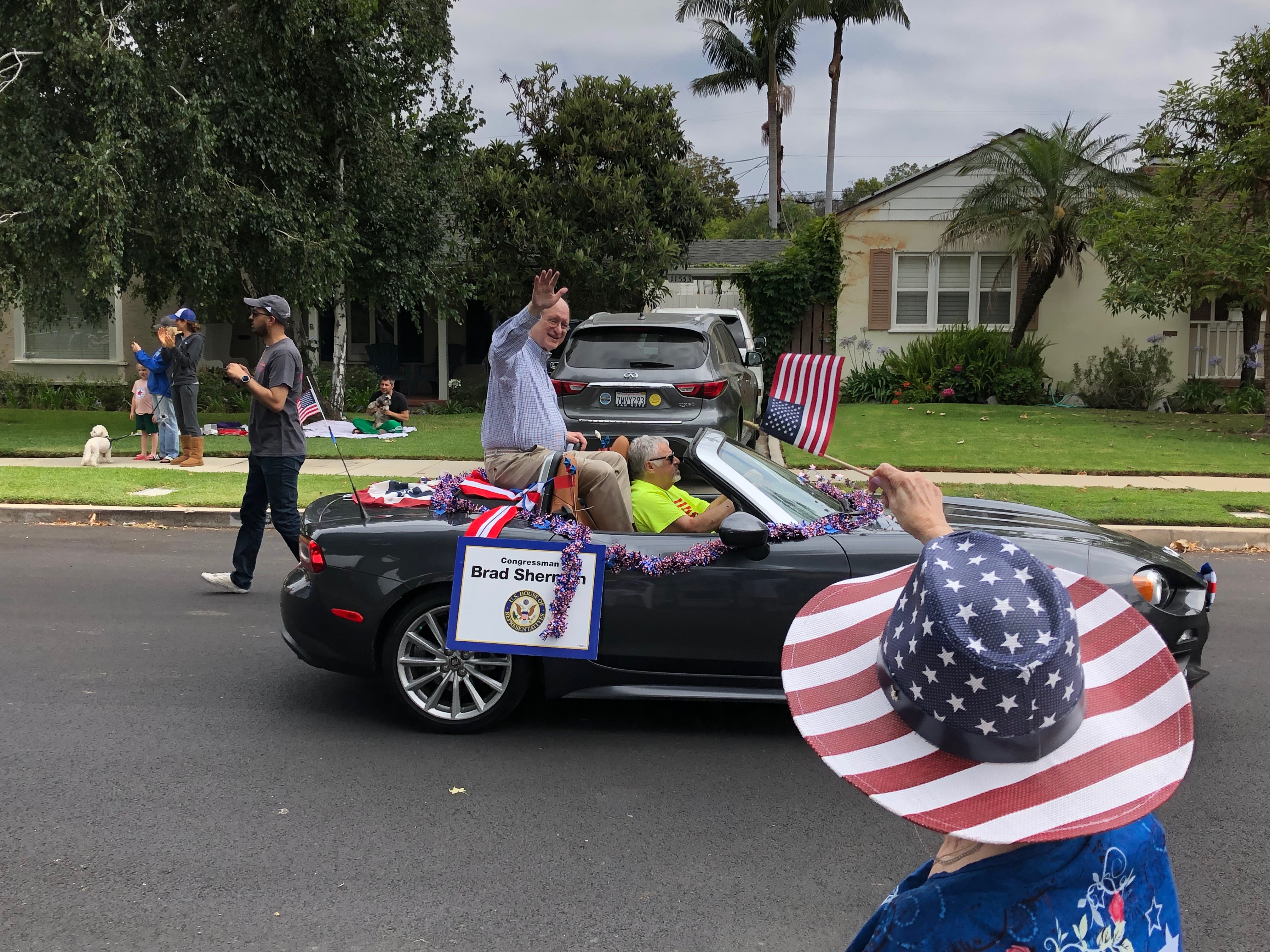 Rep. Sherman Waving to crowd at 4th of July Parade